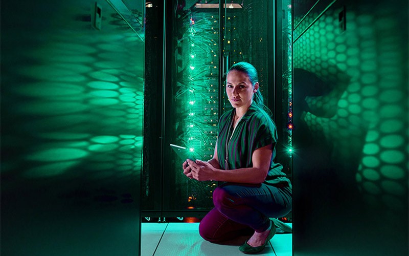 Woman using a tablet in a data centre
