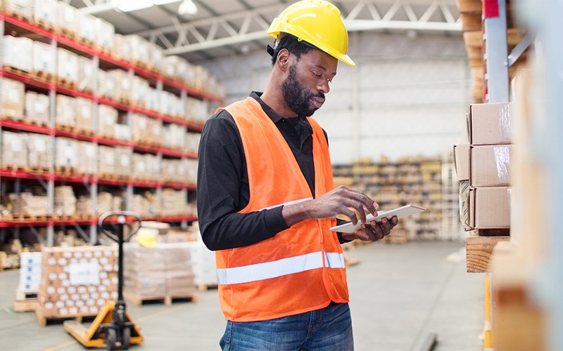 Man in high vis in a warehouse