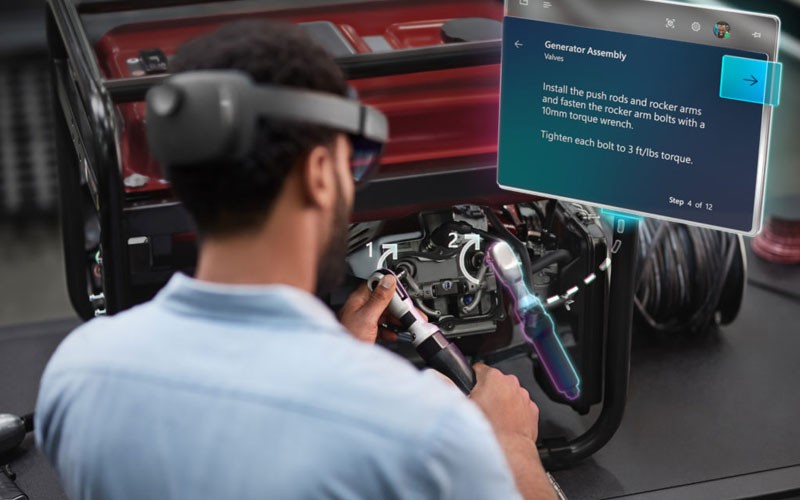 HoloLens 2 doesn’t just upgrade your immediate work environment Engineers using Microsoft Hololens 2 headset