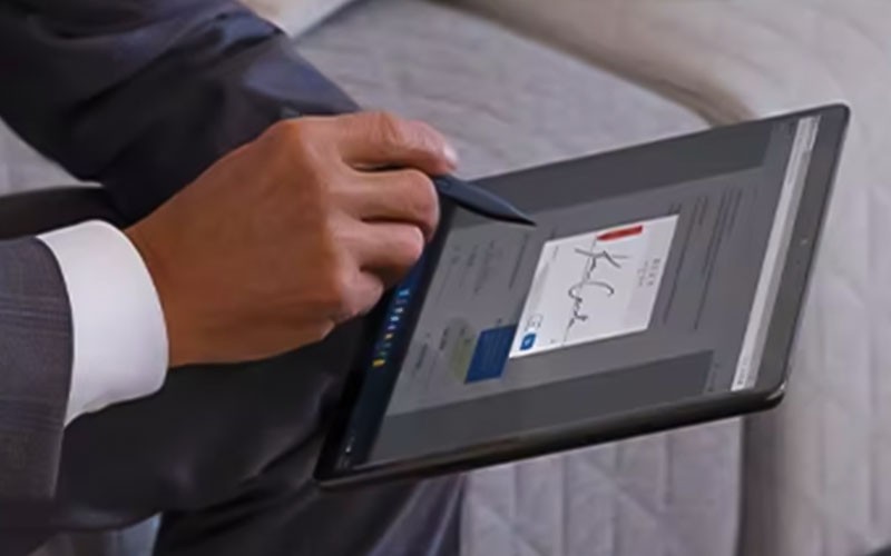 We work with you to develop a roadmap Group of colleagues working on cloud security with tablet device and computer
