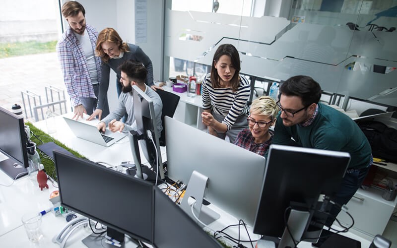 Attribute meaning to data Group of business professionals in office monitoring customer interaction