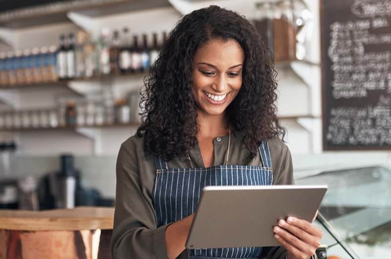 Deep enterprise application development abilities Small business owner on tablet using modern app