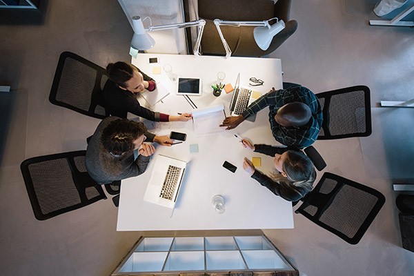 team-collaboration-at-table-from-above team-collaboration-at-table-from-above