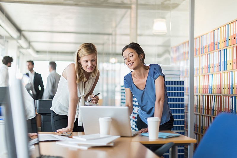 Boost productivity and deliver quality to your client Businesswomen have discussion at desktop computer in office