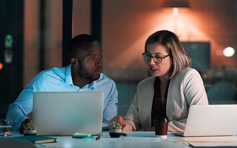 Enable efficiency and collaboration across your organization Businessman working outside on tablet device