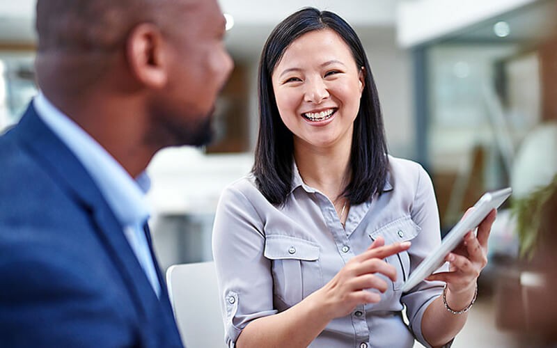 Enable efficiency and collaboration across your organization Businessman working outside on tablet device
