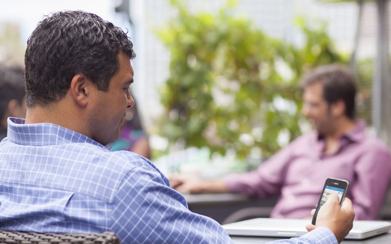 Cisco email security in the cloud Business man outside using mobile device