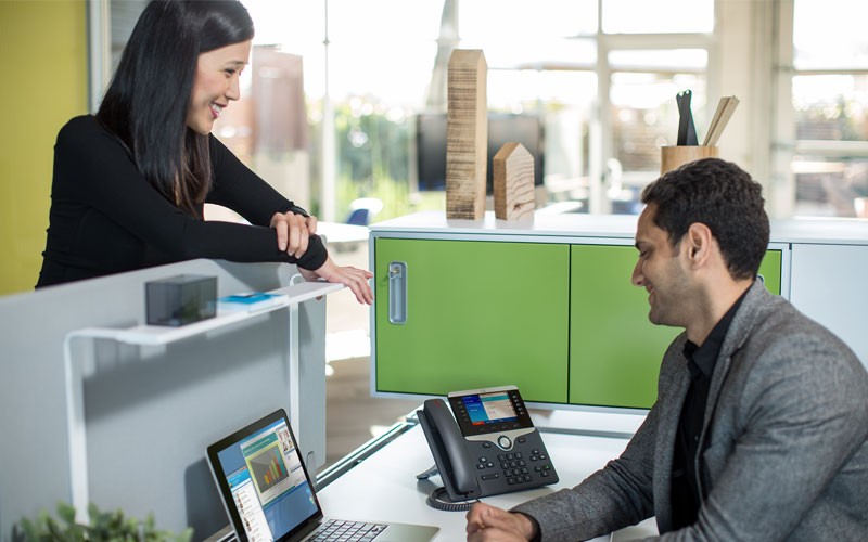 Cisco Advanced Malware Protection Employee visiting another employee at benching workstation