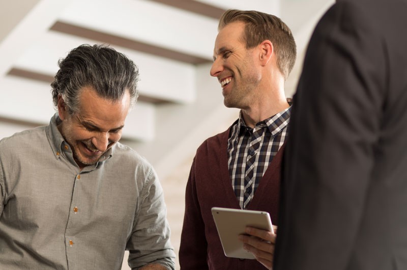 We take great pride in the clients we serve and will do everything we can to exceed your expectations. 3 business men having cheerful conversation