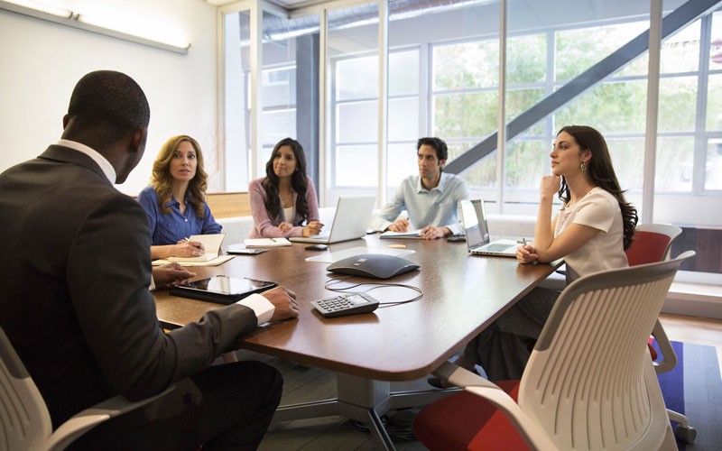 Architectures that suit your business needs. Conference room with people video conferencing.