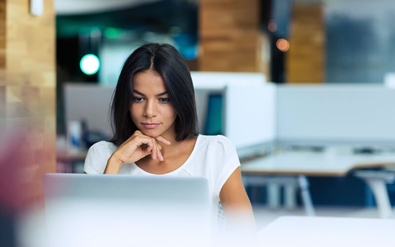 Heighten performance with zero-touch provisioning. Woman working with laptop