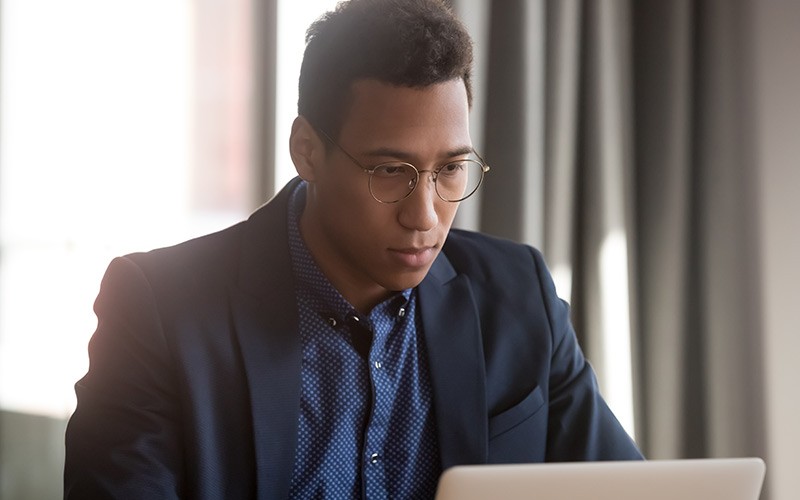 Meraki access points come with dedicated, built-in security radios. Professional working on laptop