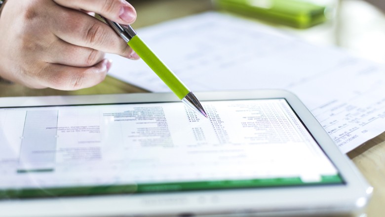 We’re committed to accountability, transparency and sustainability. Smiling business professional on tablet computer with client