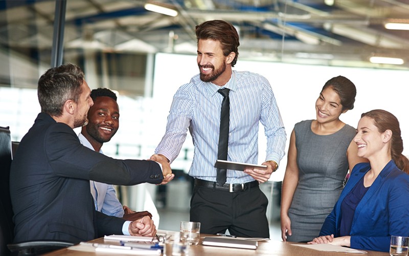 We forge strong relationships worldwide Businessman closing the deal with partners in meeting