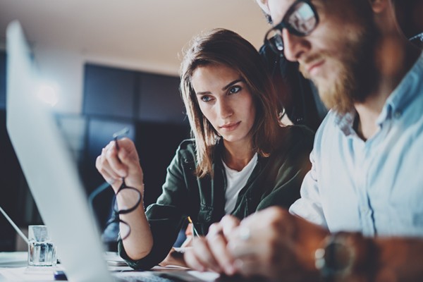 IT professionals analyzing data on computer