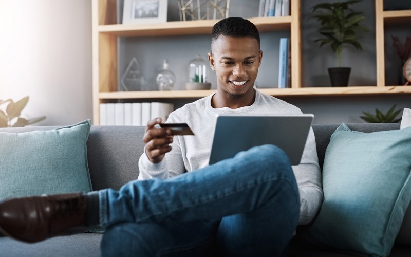 Man online shopping with tablet