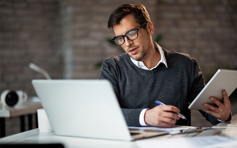 Business professional reading over ebook report