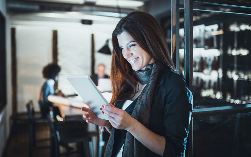 Businesswoman on tablet device in office