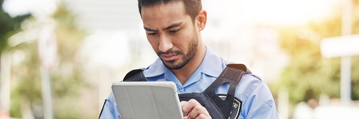 State and local officer using tablet device on field
