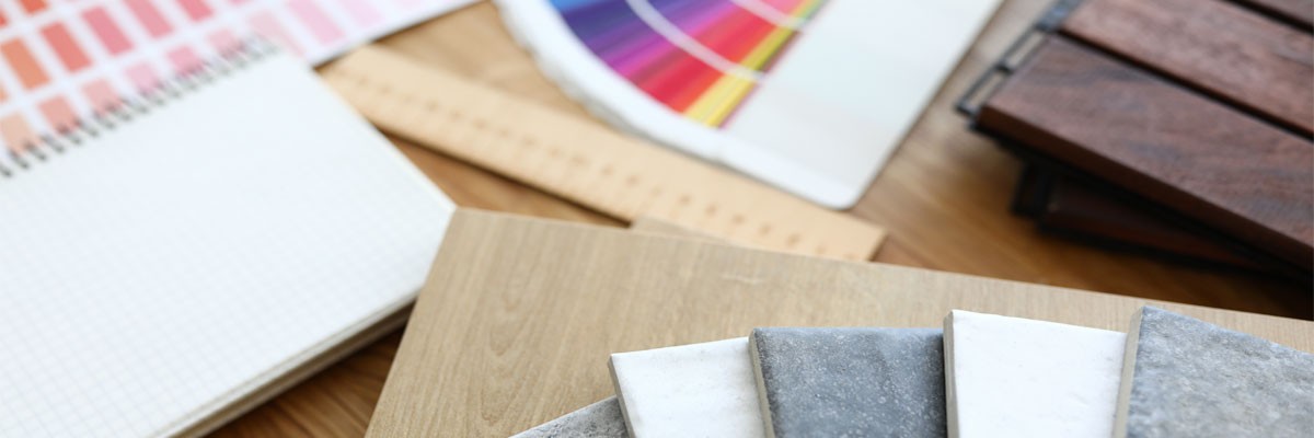 Close up view of interior design tools, color palette and tile samples
