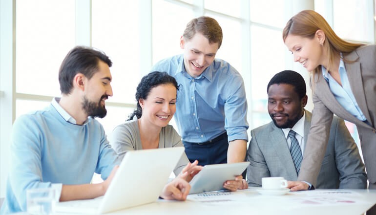 Small business team looking at a tablet