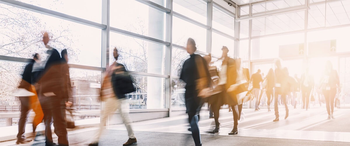 business professionals walking in an office building