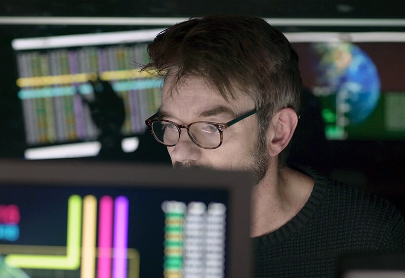 Male remote network representative reviewing client data. Remote end-users, secure access, network protection, minimize risks