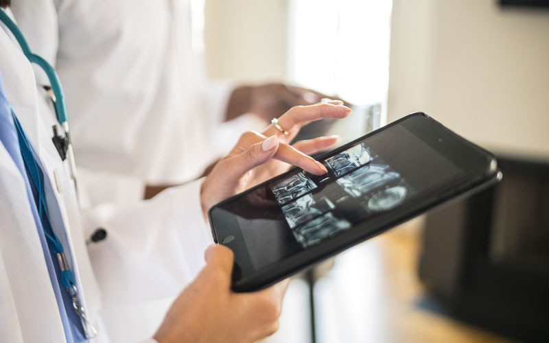 IT healthcare transformation Doctor using tablet