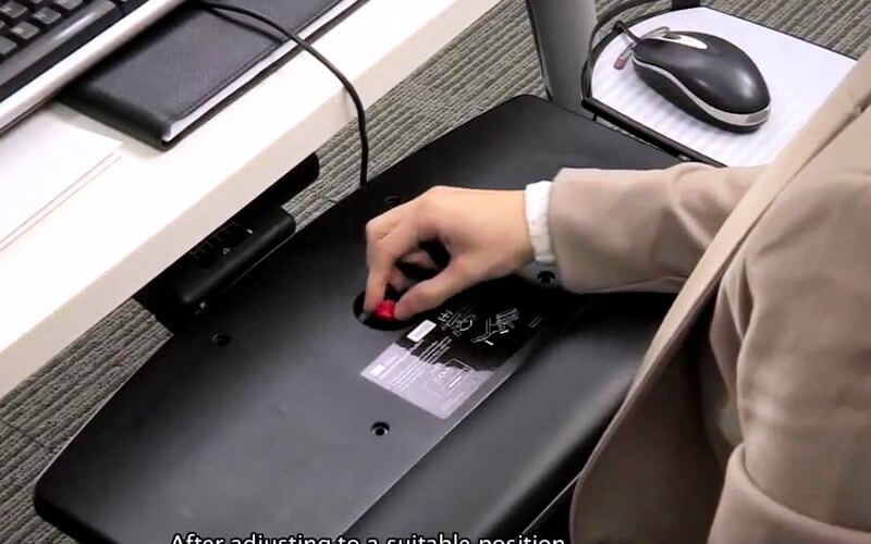 Work more comfortably. Man using 3M Adjustable Keyboard Tray