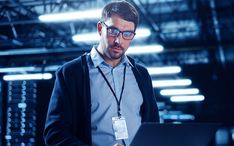 Acer Premier Service Man with glasses working using laptop