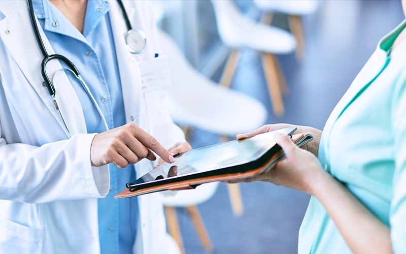 Relieve the burden of paperwork, reduce costs and dedicate more time to patient care with this intuitive solution. Doctor using tablet