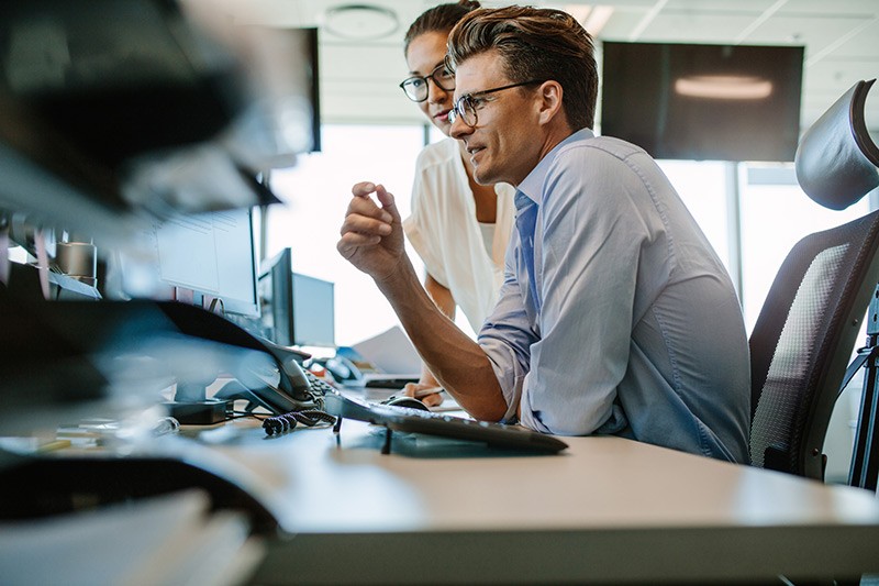 Cloud migration Business man at desk using desktop and monitor device