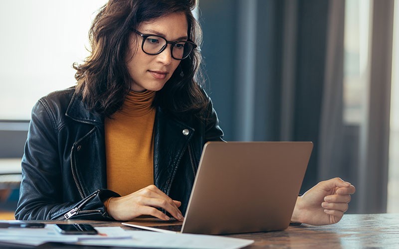 AWS DevOps services Woman working on laptop
