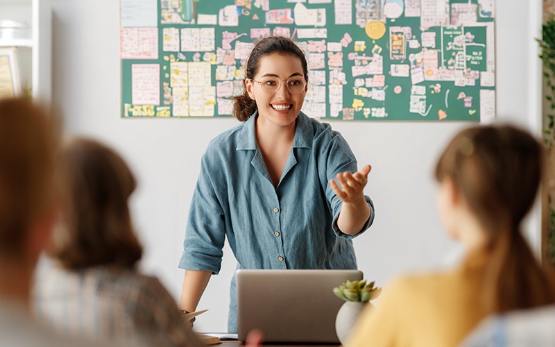 Education today is digital first. Are you prepared to support large-scale online learning Teacher discussing in front of students