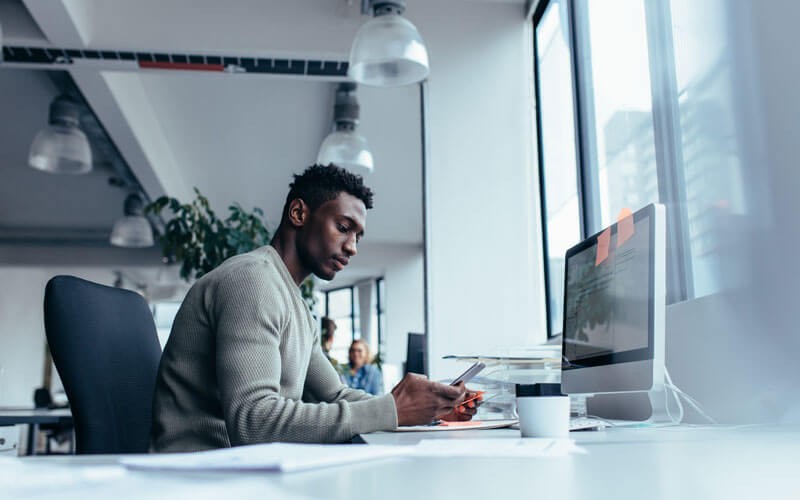 Devise a next-level mobility strategy Man texting on phone