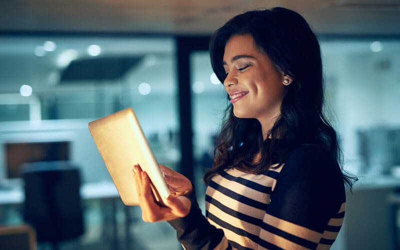 Axiom Original Equipment Manufacturers (OEMs) discontinue service Woman smiling looking at tablet