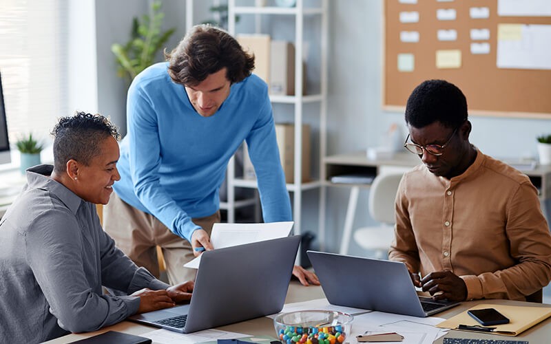 Cloud-to-Cloud Backup Teammates working together at the office
