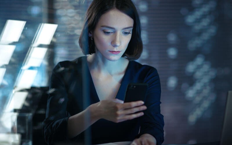 Bitdefender integration made easy Woman looking at mobile phone