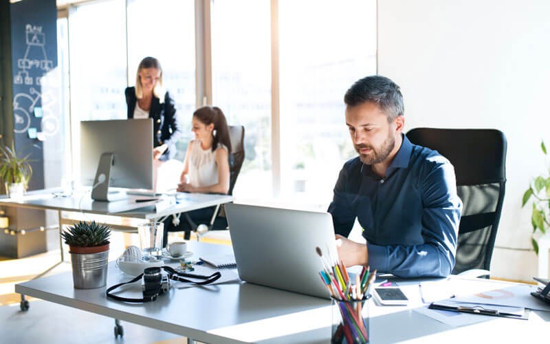 BitTitan User Migration Bundle gives you a full-service toolkit for cloud transformation Team working in office