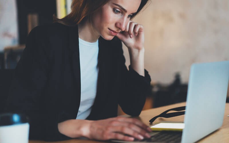 MigrationWiz offers a scalable mailbox solution Woman working on laptop