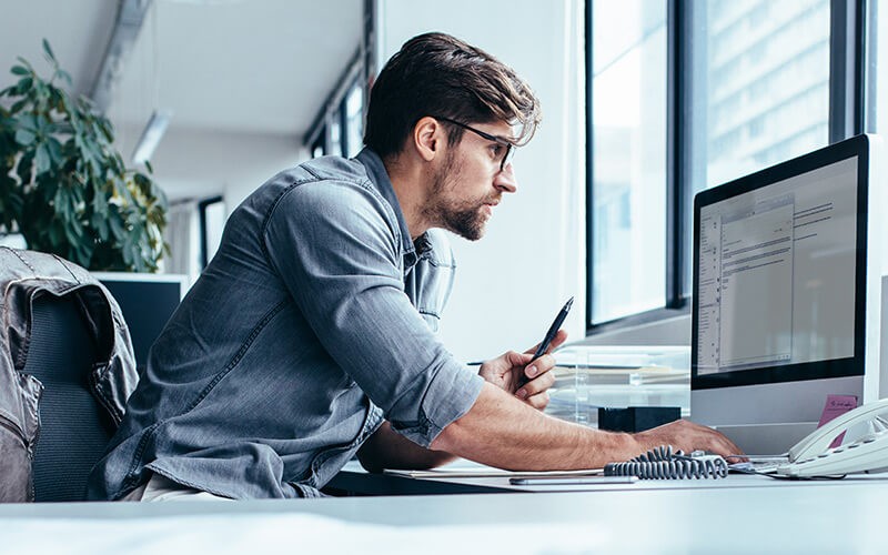 Secure everything Man using a computer at the office