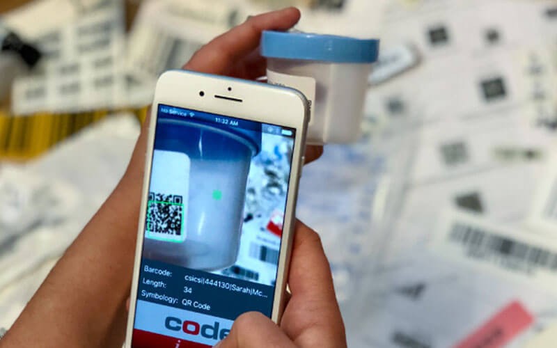 Mobile phone scanning the bar code