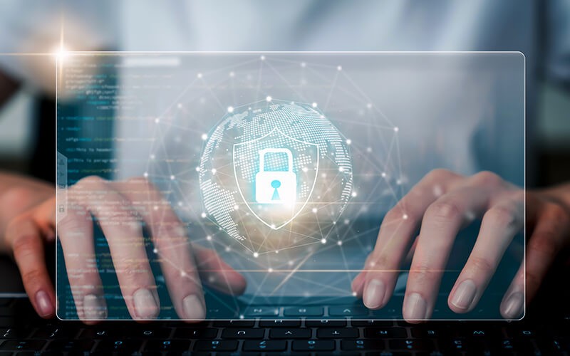 CrowdStrike Falcon X Person typing on laptop with security visual