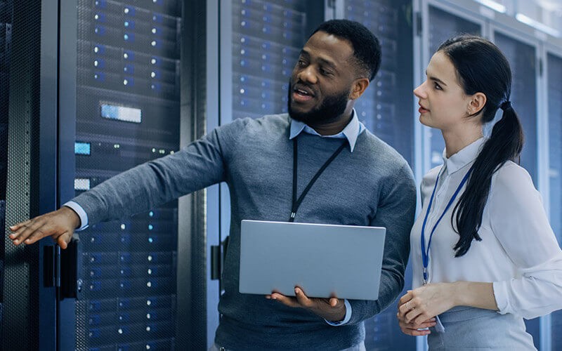 Dell lets you create custom solutions that blend existing investments Professionals working on Dell server