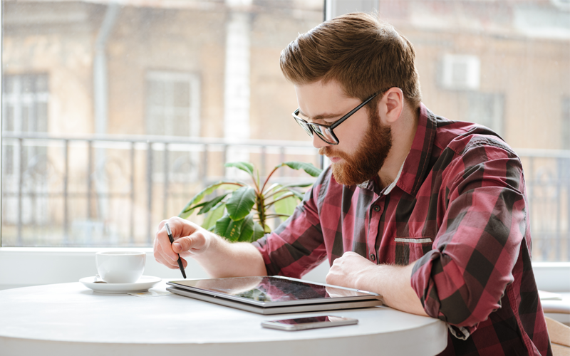 Signed documents are digitally sealed with Public Key Infrastructure Man using stylus on tablet device