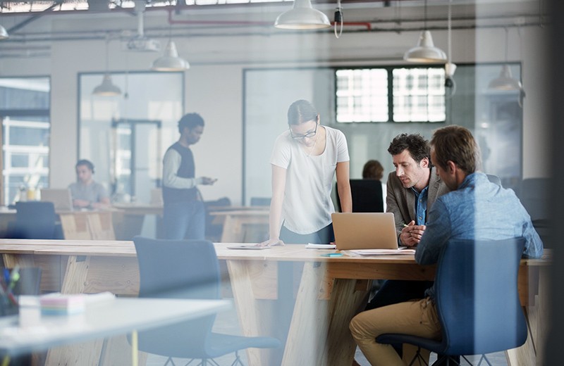 Dropbox keeps file sharing secure Group of business coworkers working together