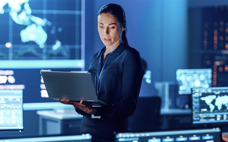 Access reliable, efficient, safe and sustainable power management and connectivity solutions Female employee using laptop
