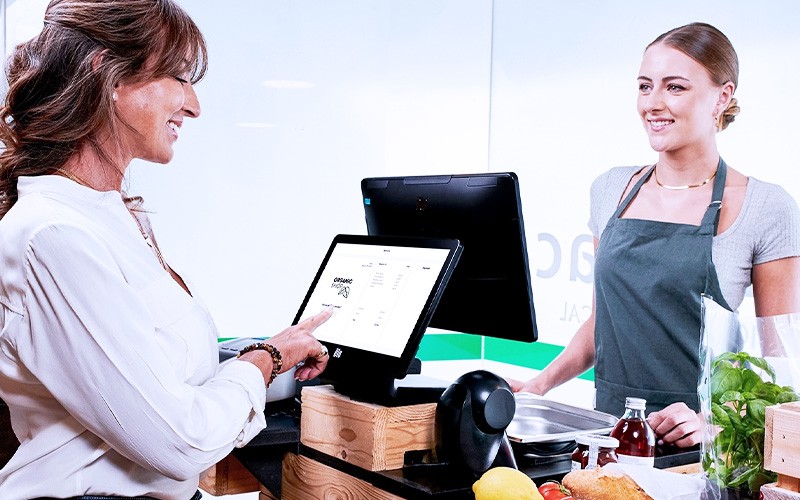 Employee making transaction using POS