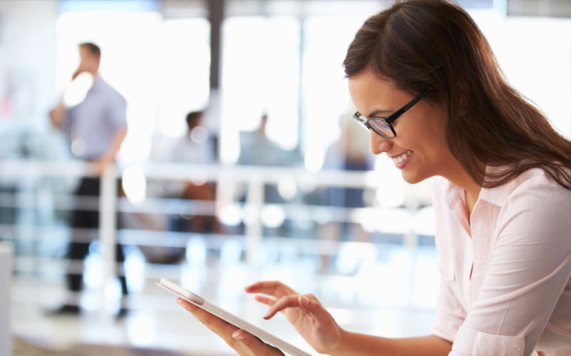 erwin enterprise modeling solutions Business woman smiling while using tablet device