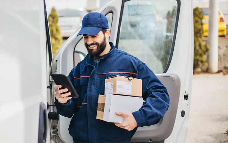 Zero-touch enrollment Delivery man smiling while working